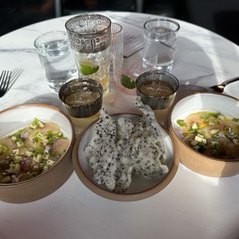 Black Iron Bystro - #1 First course crudo with cilantro oil, apples, peaches sprouts, spring onions, and lilac blossoms. Rice crisp with black sesame seeds. - Cocktail Bars Near Me - Kenmore, New York Black Iron Bystro - #1 First course crudo with cilantro oil, apples, peaches sprouts, spring onions, and lilac blossoms. Rice crisp with black sesame seeds. - Cocktail Bars Near Me - Kenmore, New York
