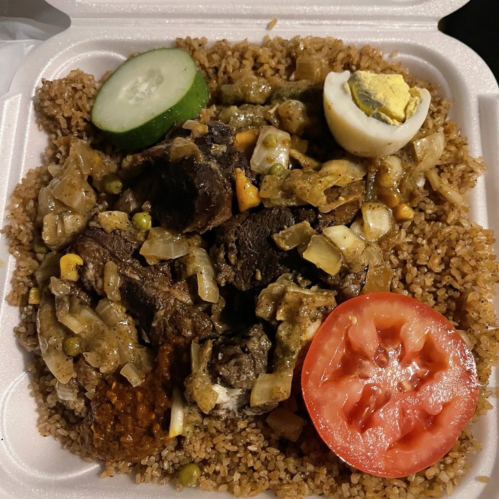 Saint-Louis Cuisine - Lamb with jollof rice Dibi - Senegalese Near Me - Atlanta, Georgia Saint-Louis Cuisine - Lamb with jollof rice Dibi - Senegalese Near Me - Atlanta, Georgia