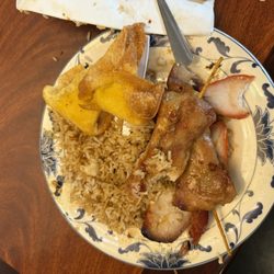 Canton Chinese Buffet - A plate of overcooked food with a rice taste hard like leftovers refried. The chicken was too dry.