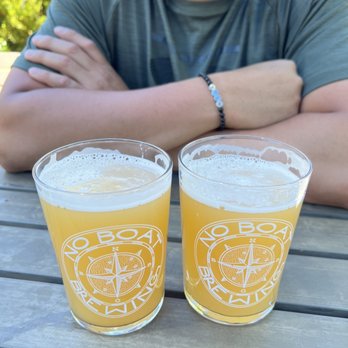 No Boat Brewing Company - Outdoor seating area with two Pilsners - Breweries Near Me - Snoqualmie, Washington No Boat Brewing Company - Outdoor seating area with two Pilsners - Breweries Near Me - Snoqualmie, Washington