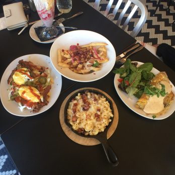 Mom's Kitchen & Bar - Clockwise starting from far left: Tex benedict; heavy metal fries; woodland omelette; return of the mac - Bars Near Me - Astoria, New York Mom's Kitchen & Bar - Clockwise starting from far left: Tex benedict; heavy metal fries; woodland omelette; return of the mac - Bars Near Me - Astoria, New York