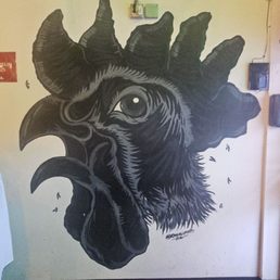 Black Rooster near the door Black Rooster near the door