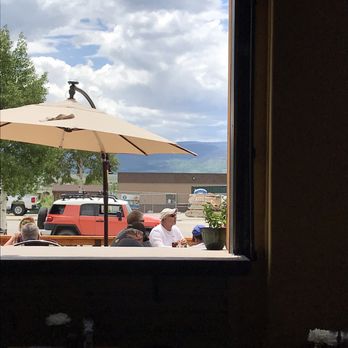 Granby Garage Kitchen + Bar - Bar area, indoor seating is booths and tables, sunny outdoor patio - Seafood Near Me - Granby, Colorado