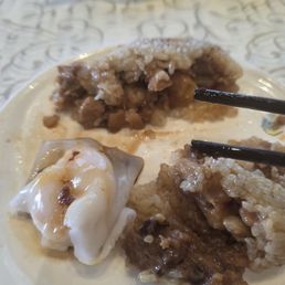 Ha cheung (shrimp rice roll) with partially raw shrimp and lo mai gai (glutinous rice wrapped in lotus leaf) that was poorly flavored. Ha cheung (shrimp rice roll) with partially raw shrimp and lo mai gai (glutinous rice wrapped in lotus leaf) that was poorly flavored.