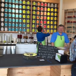 Talking tea and taking tea tins down from the tea wall.