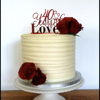 Bomb Shelley’s Bakery - a white cake with red roses on top - Custom Cakes Near Me Bomb Shelley’s Bakery - a white cake with red roses on top - Custom Cakes Near Me
