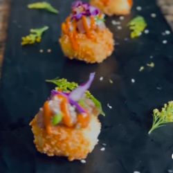 BiteSize Kitchen - Crisped rice cake layered with marinated tuna poke, brightened with fresh dill. Clean flavors. Crisp texture.