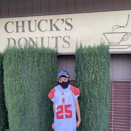 Exterior outside entrance of Chuck's Donuts - Pre-game youth football breakfast - Redwood City, California Exterior outside entrance of Chuck's Donuts - Pre-game youth football breakfast - Redwood City, California