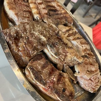 Renzo's - All beef parilla, skirt steak, flaked style ribs, ny strip, sirloin. lot of fatty edges. Had to ask for chimichurri sauce to eat with it. - Argentine Near Me - Tampa, Florida