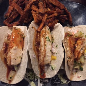 Riptides Raw Bar & Grill - Grilled mahi tacos with sweet potato fries - messy, but delicious! - Seafood Near Me - Ormond Beach, Florida Riptides Raw Bar & Grill - Grilled mahi tacos with sweet potato fries - messy, but delicious! - Seafood Near Me - Ormond Beach, Florida