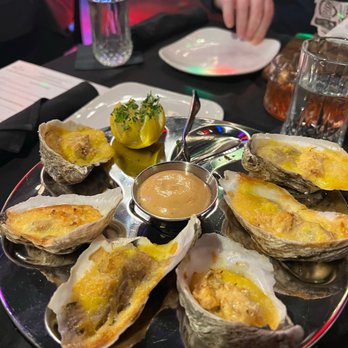 Deluxe Fun Dining - BAKED DELUXE OYSTERS - Bars Near Me - Charlotte, North Carolina Deluxe Fun Dining - BAKED DELUXE OYSTERS - Bars Near Me - Charlotte, North Carolina