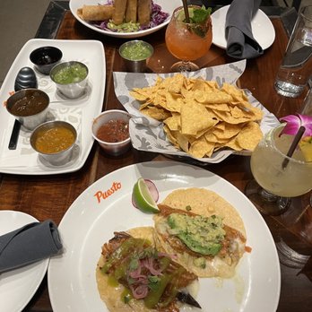 Puesto Concord - Chef's salsa bar (left), Potato Taquitos (top), Mushroom Taco + Verduras Taco (bottom) - Mexican Near Me - Concord, California Puesto Concord - Chef's salsa bar (left), Potato Taquitos (top), Mushroom Taco + Verduras Taco (bottom) - Mexican Near Me - Concord, California
