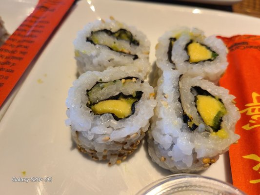 Photo of TGI Fridays - Orange, CA, US. three sushi rolls on a plate