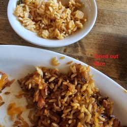 Lone Star Texas Grill - Dried-out rice. Must have been left on the heater so long that the rice changed colour. The small bowl is that the rice should be.