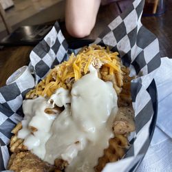 Starbrick Bbq - Loaded Waffle Fries with Shredded chicken. We got half shredded cheese half queso, highly recommend getting the queso!