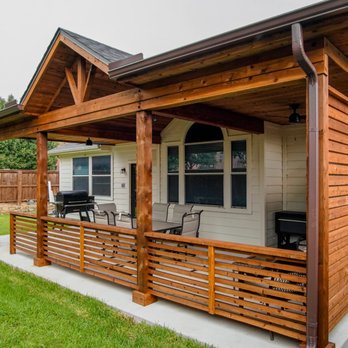 Elegance Outdoor Living - a covered porch with a grill - Landscaping Near Me Elegance Outdoor Living - a covered porch with a grill - Landscaping Near Me