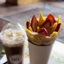Bru Chicago - Strawberry Mango crepe $10.50  Ice Coffee vanilla $8.50  Total : $ 18.19