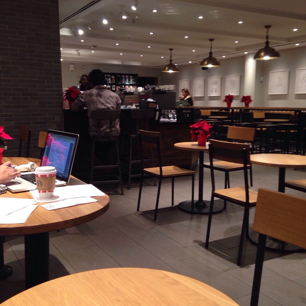 Starbucks - a woman sitting at a table with a laptop - Coffee & Tea Near Me - Brampton, Ontario Starbucks - a woman sitting at a table with a laptop - Coffee & Tea Near Me - Brampton, Ontario
