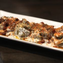 Afghan Kitchen Restaurant - Aushak ($7.99) - Dumplings with leek (gandana) filling, topped with garlicky yogurt sauce and kidney beans.