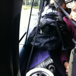 Tommy's Taxi Service of Bayshore - Since every inch of the van is filled with passengers, the only place for luggage is along the aisle, blocking the exits.