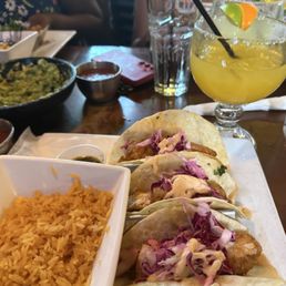 Fresh guac, fish tacos and a house margarita. Fresh guac, fish tacos and a house margarita.