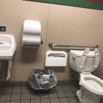 Wingstop - Filthy bathroom covered with scum, paper hanging out of the toilet and urine on the floor. Stains in the sink. - Chicken Wings Near Me - Highland, California