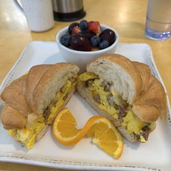 The Egg Kings - Egg croissant sandwich with sausage instead of ham and a side of fruit instead of potatoes -- soooo yummy!! - Breakfast & Brunch Near Me - Loveland, Colorado The Egg Kings - Egg croissant sandwich with sausage instead of ham and a side of fruit instead of potatoes -- soooo yummy!! - Breakfast & Brunch Near Me - Loveland, Colorado