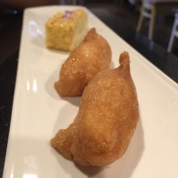 Sun Sushi - Inari: marinated bean curd skins stuffed with sushi rice. - Japanese Near Me - Santa Barbara, California Sun Sushi - Inari: marinated bean curd skins stuffed with sushi rice. - Japanese Near Me - Santa Barbara, California