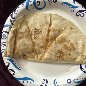 Taco Bell - This is how my Chicken Quesadilla came out and one of the sides has NO FILLING - Fast Food Near Me - Queensbury, New York