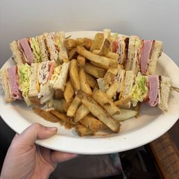 Club sandwich with fries