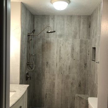 Carl Marino Handyman - a bathroom with a toilet and shower - Carpenters Near Me Carl Marino Handyman - a bathroom with a toilet and shower - Carpenters Near Me