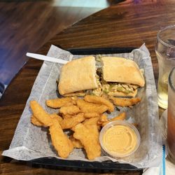 The Olive Pit Bar and Grill - Chicken Philly with onion petals