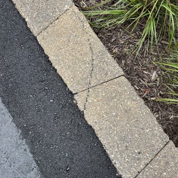TomCo Asphalt - Made the driveway LEVEL with the wall and spilled asphalt on the wall. Ruined the wall on one side . - Masonry/Concrete Near Me - Mason, Michigan TomCo Asphalt - Made the driveway LEVEL with the wall and spilled asphalt on the wall. Ruined the wall on one side . - Masonry/Concrete Near Me - Mason, Michigan