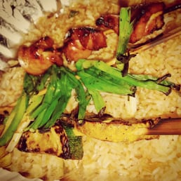 Chicken, green onion, and Zucchini/Squash Skewers on a bed of rice