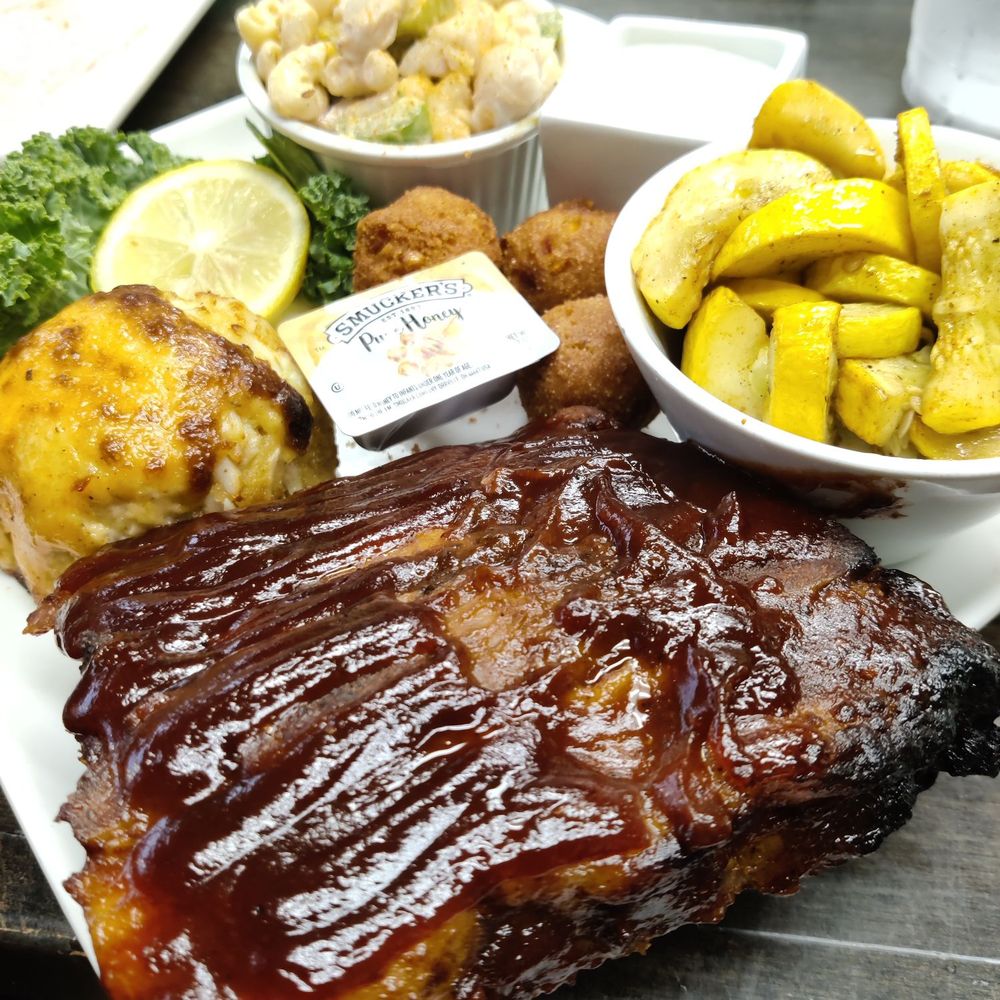 July special: baby back ribs, crab cake, squash, Mac salad, hush puppies July special: baby back ribs, crab cake, squash, Mac salad, hush puppies