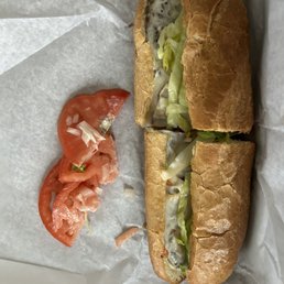Cheeseburger sub with "lettuce, pickles and mayo"  Where's the pickles and mayo? And why is there tomato and onions?