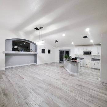 Expert Flooring Solutions - Grey wood-like porcelain tile with 4in baseboards - Flooring Near Me - Las Vegas, Nevada Expert Flooring Solutions - Grey wood-like porcelain tile with 4in baseboards - Flooring Near Me - Las Vegas, Nevada