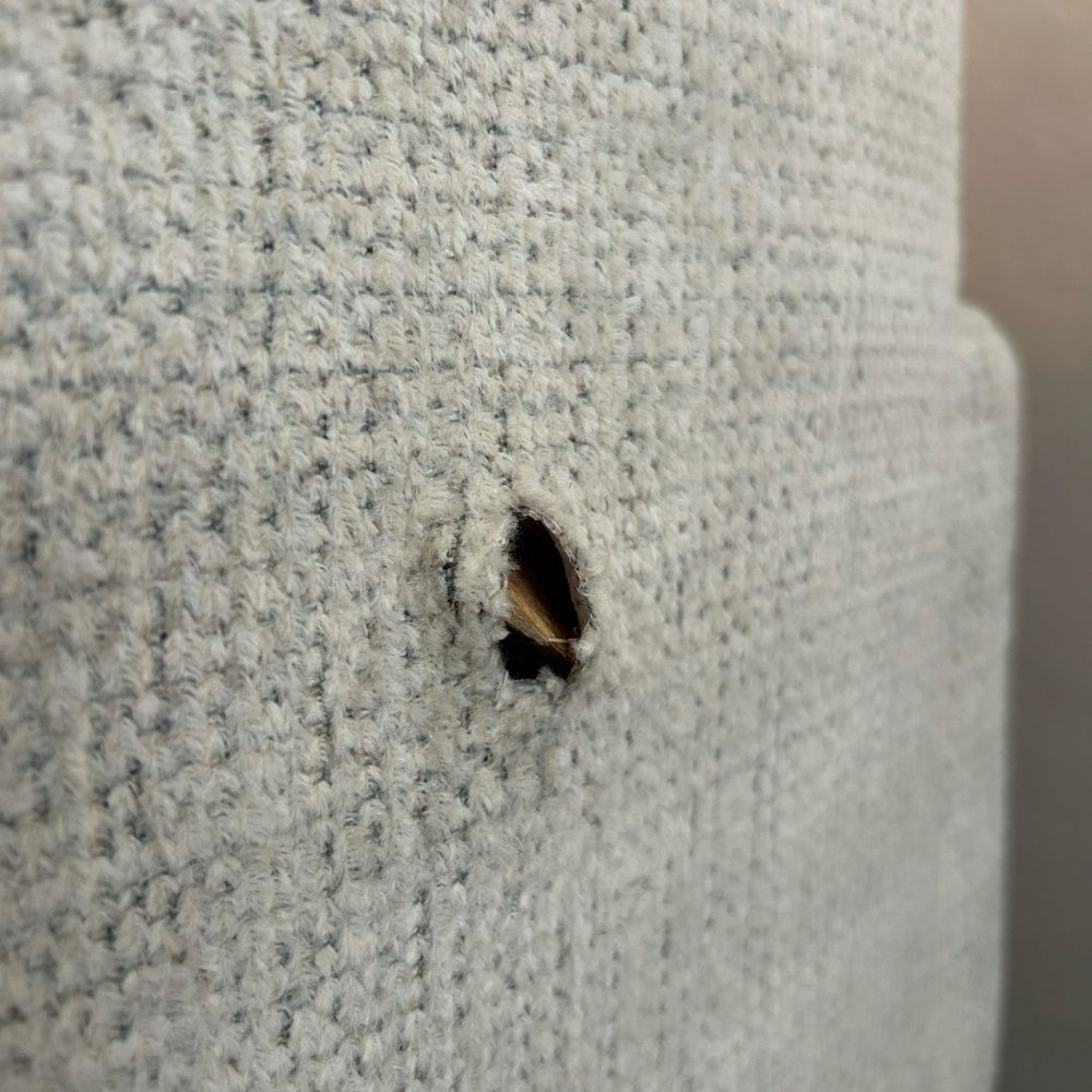 Ashley Store - Hole and bulge with shredded wood poking through. "We'll just see a new cover on and call it good" - Ashley - Furniture Stores Near Me - Lathrop, California