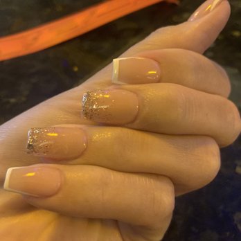 Moschino Nails - White edging with glitter tips. - Nail Salons Near Me - Roseville, California
