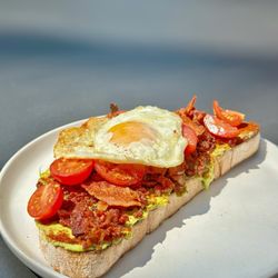 KIT Coffee - SMOKED AVOCADO TOAST - with extra bacon, cherry, tomato, smoked paprika, lemon zest, chives *added a fried egg