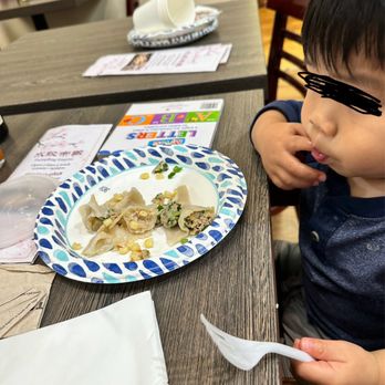 Dumpling Empire - Our Little guy enjoying his chicken and corn dumplings. - Dim Sum Near Me - South San Francisco, California Dumpling Empire - Our Little guy enjoying his chicken and corn dumplings. - Dim Sum Near Me - South San Francisco, California