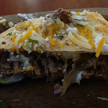 Coyote Cafe - Four-piece Beef Birria and Horsey Quesadilla (w/cup of sour cream): The beef was tender and juicy, though that made this messy to pick up - Mexican Near Me - Hamburg, New York Coyote Cafe - Four-piece Beef Birria and Horsey Quesadilla (w/cup of sour cream): The beef was tender and juicy, though that made this messy to pick up - Mexican Near Me - Hamburg, New York