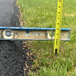 Asphalt Driveway Solutions - This is off the back of my driveway to the backyard. I know need to remove the sod fill with loam and replace the sod all around driveway