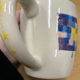 dark smudges/marks on the outside of the painted mug