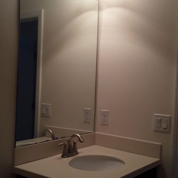 Builtry - a bathroom with a sink, mirror, and toilet - Painters Near Me - Tampa Bay, Florida Builtry - a bathroom with a sink, mirror, and toilet - Painters Near Me - Tampa Bay, Florida