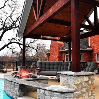 Signature Pools - a patio with a fire pit - Landscaping Near Me - Bixby, Oklahoma