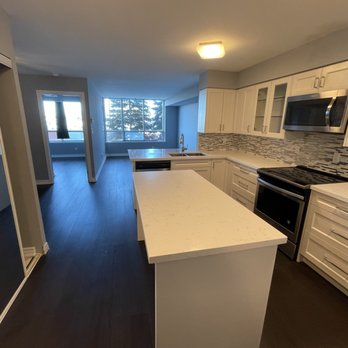 Arbint Reno - a kitchen with white cabinets and white countertops - General Contractors Near Me Arbint Reno - a kitchen with white cabinets and white countertops - General Contractors Near Me