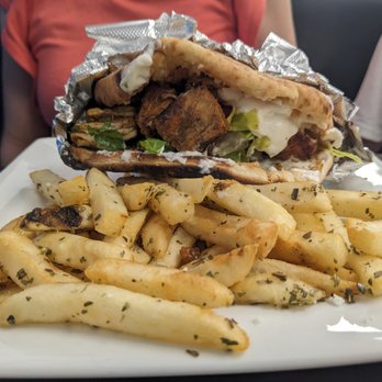 Simply Delicious - a plate of french fries and a sandwich - Mediterranean Near Me - Greenville, North Carolina Simply Delicious - a plate of french fries and a sandwich - Mediterranean Near Me - Greenville, North Carolina