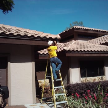 S2W Security - S2W Technician installs surveillance camera - Security Services Near Me - Tampa, Florida S2W Security - S2W Technician installs surveillance camera - Security Services Near Me - Tampa, Florida
