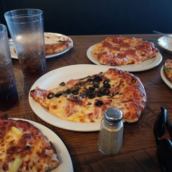Savelli's Pizza - Size Comparison. These are single slice. Really big and amazing. Also you have to have the cheese bread. - Pizza Near Me - Manitou Springs, Colorado Savelli's Pizza - Size Comparison. These are single slice. Really big and amazing. Also you have to have the cheese bread. - Pizza Near Me - Manitou Springs, Colorado